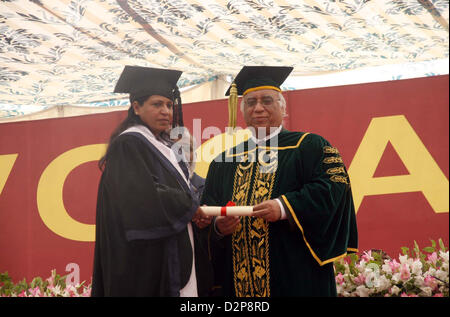 Karachi University Vice Chancellor, Dr. Muhammad Qaisar  Awarding PhD degree to Dr. Raana Khan, the first woman PhD in law across Pakistan, during  Annual Convocation 2013, held at Valika Ground in Karachi University premises on  Wednesday, January 30, 2013. Stock Photo