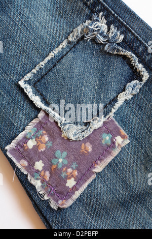 patches on toddler's denim jeans Stock Photo