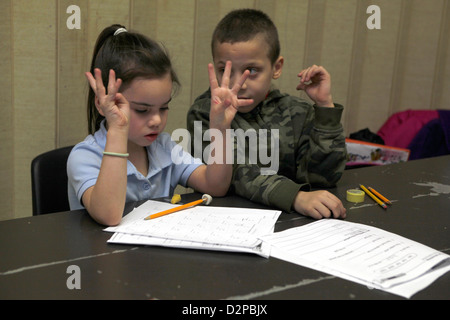 Children participate in an after school homework & education program on the Lower East Side, NYC Stock Photo