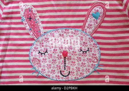 bunny detail on toddler's striped clothing - applique Stock Photo