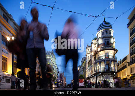 Seville, Spain, pedestrians on the Avenida de la Constitucion in the evening Stock Photo