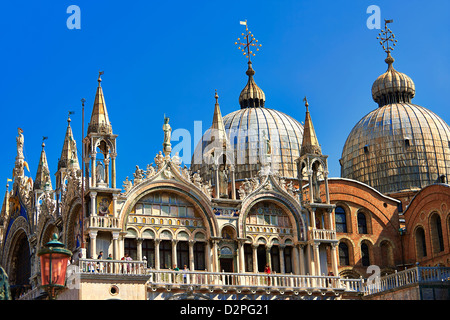 Facade with Gothic architecture and Romanesque domes of St Mark's Basilica, Venice Stock Photo