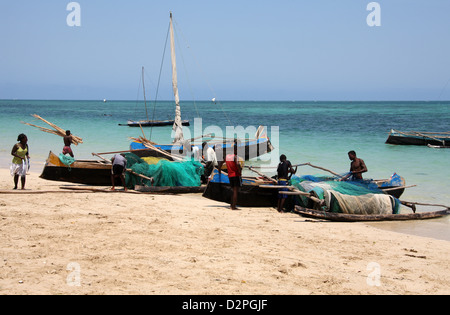 Malagasy Fishermen and Their Outrigger Pirogues.  Anakao, Madagascar, Africa. A Small Boat Mainly Used for Fishing. Stock Photo