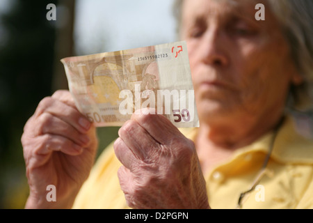 Berlin, Germany, the hands of a pensioner with a Euro bill Stock Photo