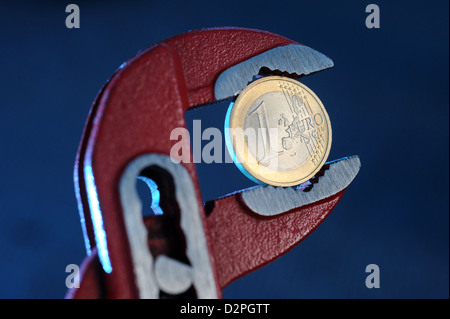 Berlin, Germany, a euro in the forceps Stock Photo