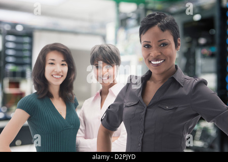 Businesswomen standing in server room Stock Photo