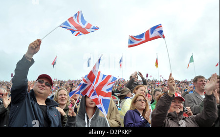 Crowds cheering and waving union flags. Equestrian Eventing Stock Photo