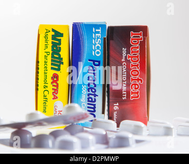 Three painkiller boxes containing ibuprofen, paracetamol and aspirin