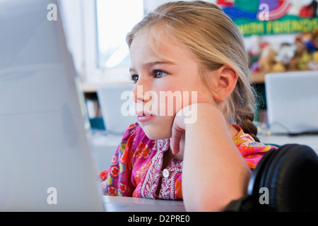 Caucasian girl using computer