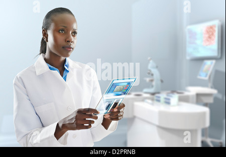 African American doctor using digital tablet in laboratory Stock Photo