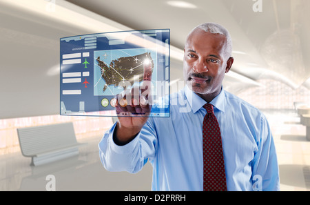 Black businessman using digital display Stock Photo