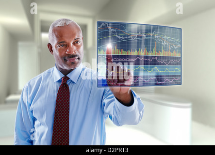 Black businessman using digital display Stock Photo