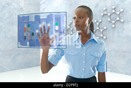 African American businesswoman using digital display Stock Photo