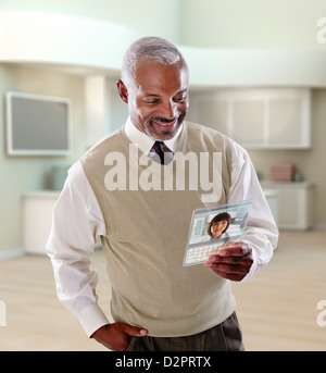 Black businessman using digital tablet in office Stock Photo