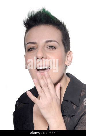 Woman with hand over mouth Stock Photo
