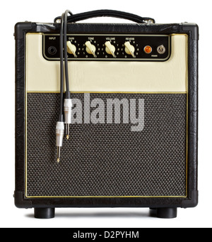 black vintage guitar amplifier with cable, isolated on white Stock Photo