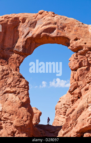 Lone hiker in Turret Arch, Arches National Park, near Moab, Utah, United States of America, North America Stock Photo