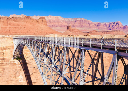 Lone tourist on Old Navajo Bridge over Marble Canyon and Colorado River, near Lees Ferry, Arizona, USA Stock Photo