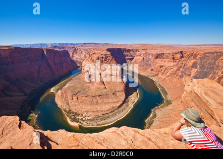 Tourist overlooking Horseshoe Bend on the Colorado River, Page, Arizona, United States of America, North America Stock Photo