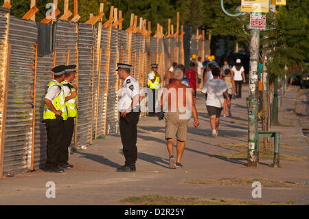 Jan. 30, 2013 - Buenos Aires, Buenos Aires, Argentina - Buenos Aires Metropolitan Police, under orders of Mayor Mauricio Macri, protects a provisional fence around Parque Centenario. The fence covers the works undergoing to put bars on the park to close it in the nights. Many neighbours oppose that decision and in previous days destroyed the protective fence, clashing with the Police. Today, a court ordered the government to stop all works until the Judge hears the neighbours reasons. (Credit Image: © Patricio Murphy/ZUMAPRESS.com) Stock Photo