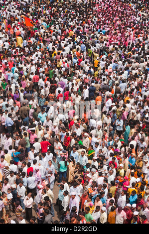 Crowd at religious procession during Ganpati visarjan ceremony, Mumbai, Maharashtra, India Stock Photo