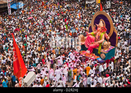 Crowd at religious procession during Ganpati visarjan ceremony, Mumbai, Maharashtra, India Stock Photo