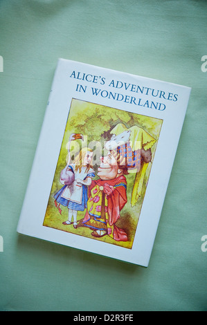 Alice's Adventures in Wonderland by Lewis Carroll with dust jacket illustration by Sir John Tenniel book published by Macmillan. Stock Photo