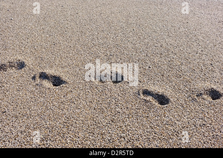 Footsteps in sand Stock Photo