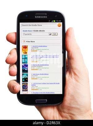 Amazon Kindle store on a smartphone mobile phone smart phone, 2012 Stock Photo