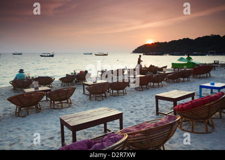 Beach restaurants at dusk on Ochheuteal Beach, Sihanoukville, Cambodia, Indochina, Southeast Asia, Asia Stock Photo