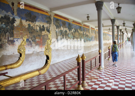 Woman looking at murals at Silver Pagoda in Royal Palace, Phnom Penh, Cambodia, Indochina, Southeast Asia, Asia Stock Photo