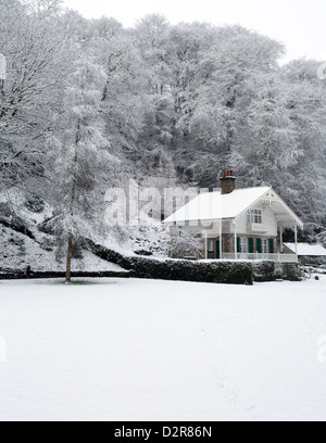 Swiss chalet in Simmons Park Okehampton Devon, with a covering of snow. Stock Photo