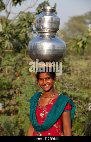Young woman fetching water, Mathura, Uttar Pradesh, India, Asia Stock Photo
