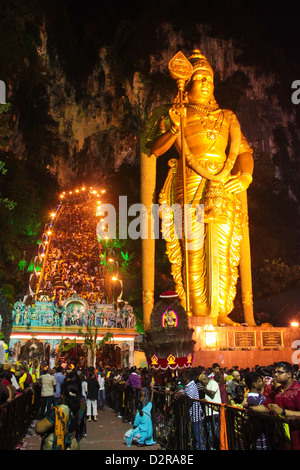 Crowd of spectators and devotees in front the huge Murugan statue at Batu Cave temple, Malaysia during Thaipusam festival. Stock Photo