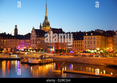 Gamla Stan and Riddarholmen with spire of Riddarholmskyrkan (Riddarholmen Church) at dusk, Stockholm, Sweden Stock Photo