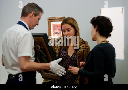 London, UK. 31 January 2013.  A visitor looks at a painting during the press preview of the Sotheby's forthcoming February sales of Impressionist & Modern Art and Contemporary Art in London, including works by Picasso, Bacon, Monet, Richter, Miró, Basquiat. Credit:  pcruciatti / Alamy Live News Stock Photo
