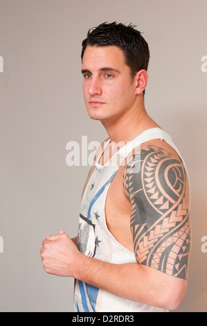 Attractive handsome hunky young man in singlet vest. Stock Photo