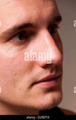 Close up cropped portrait of handsome young man face Stock Photo