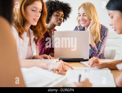 Businesswomen working together in meeting Stock Photo
