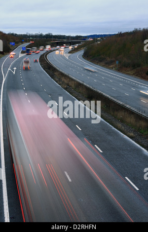 A slow speed shot of traffic traveling along the M20 motorway in Kent, England. Stock Photo