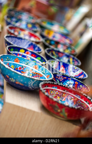 Small beautiful arabic colorful pottery bowls arranged in a row at the street market of Antalya, Turkey Stock Photo