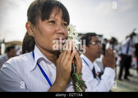 Phnom Penh, Cambodia. 1st February 2013.  A mourner watches the funeral procession of former Cambodian King Norodom Sihanouk in Phnom Penh. Norodom Sihanouk (31 October 1922 “ 15 October 2012) was the King of Cambodia from 1941 to 1955 and again from 1993 to 2004. ed to attend. Credit:  ZUMA Press, Inc. / Alamy Live News Stock Photo