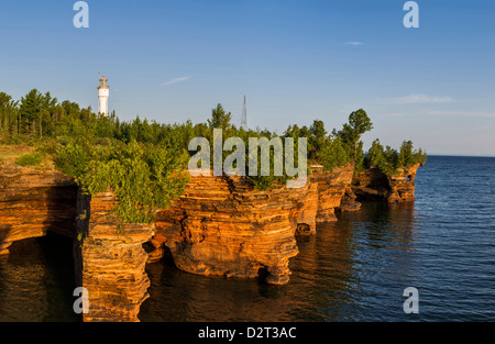 Sandstone cliffs and sea caves on Devils Island Lighthouse in the Apostle Islands National Lakeshore, Wisconsin, USA. (MR) Stock Photo