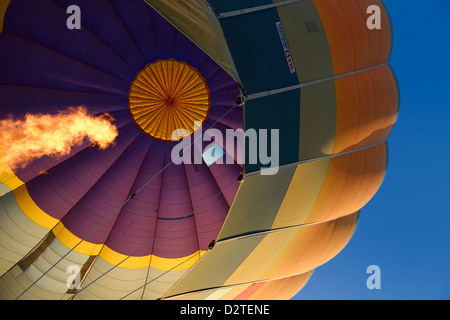 View from basket up to flame from propane heater inflating hot air balloon in Cappadocia Goreme National Park Nevsehir Turkey Stock Photo