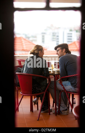 Young couple at Café Noobai, Lisbon, Portugal. Stock Photo