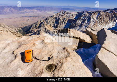 SPOT messenger and USGS marker on the summit of Mount Whitney, Sequoia National Park, California USA Stock Photo