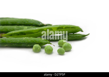 Fresh green pea pods isolated on white. Stock Photo