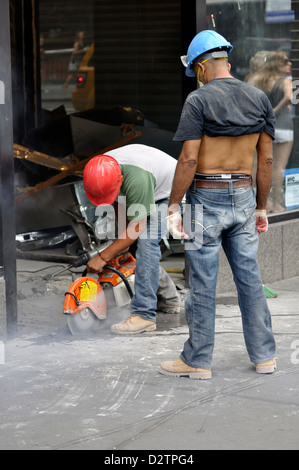 Pavement cutting with concrete saw in New York City, USA Stock Photo