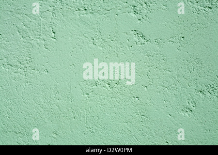 Close up detail of vertical wall showing texture of blue green painted slightly pitted surface Stock Photo