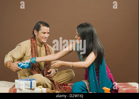 Sister snatching gift from her brother at the festival of Rakhi Stock ...